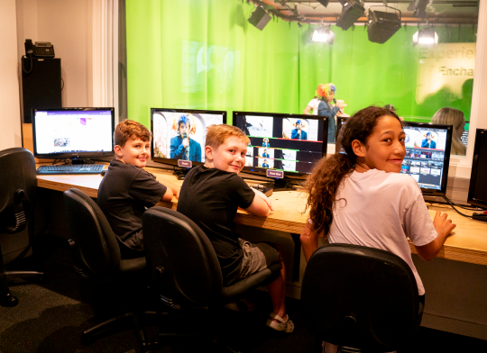 Three children in the editing suite in OnTV.